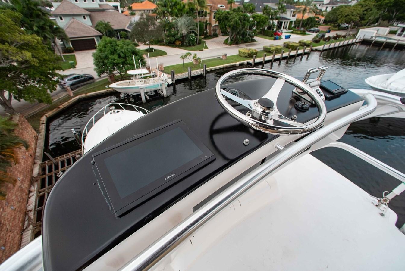 a car with a screen on the hood aboard CURIOUS GEORGE Yacht for Sale