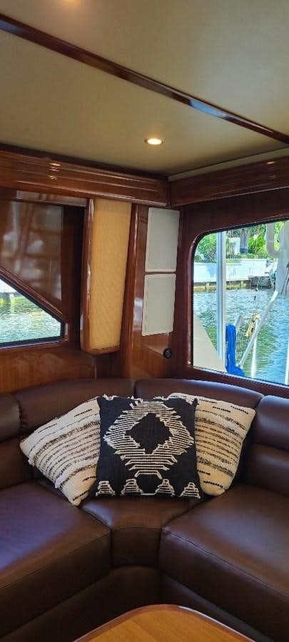 a couch with pillows aboard CURIOUS GEORGE Yacht for Sale