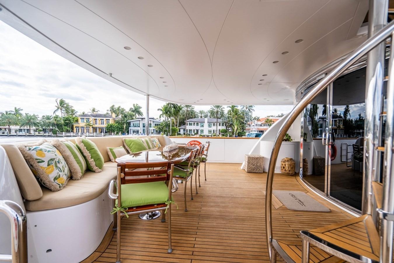 a living room with a glass door aboard DREAMER Yacht for Sale