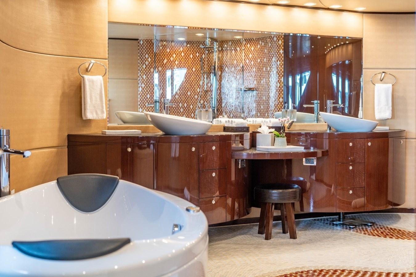 a bathroom with a large mirror aboard DREAMER Yacht for Sale