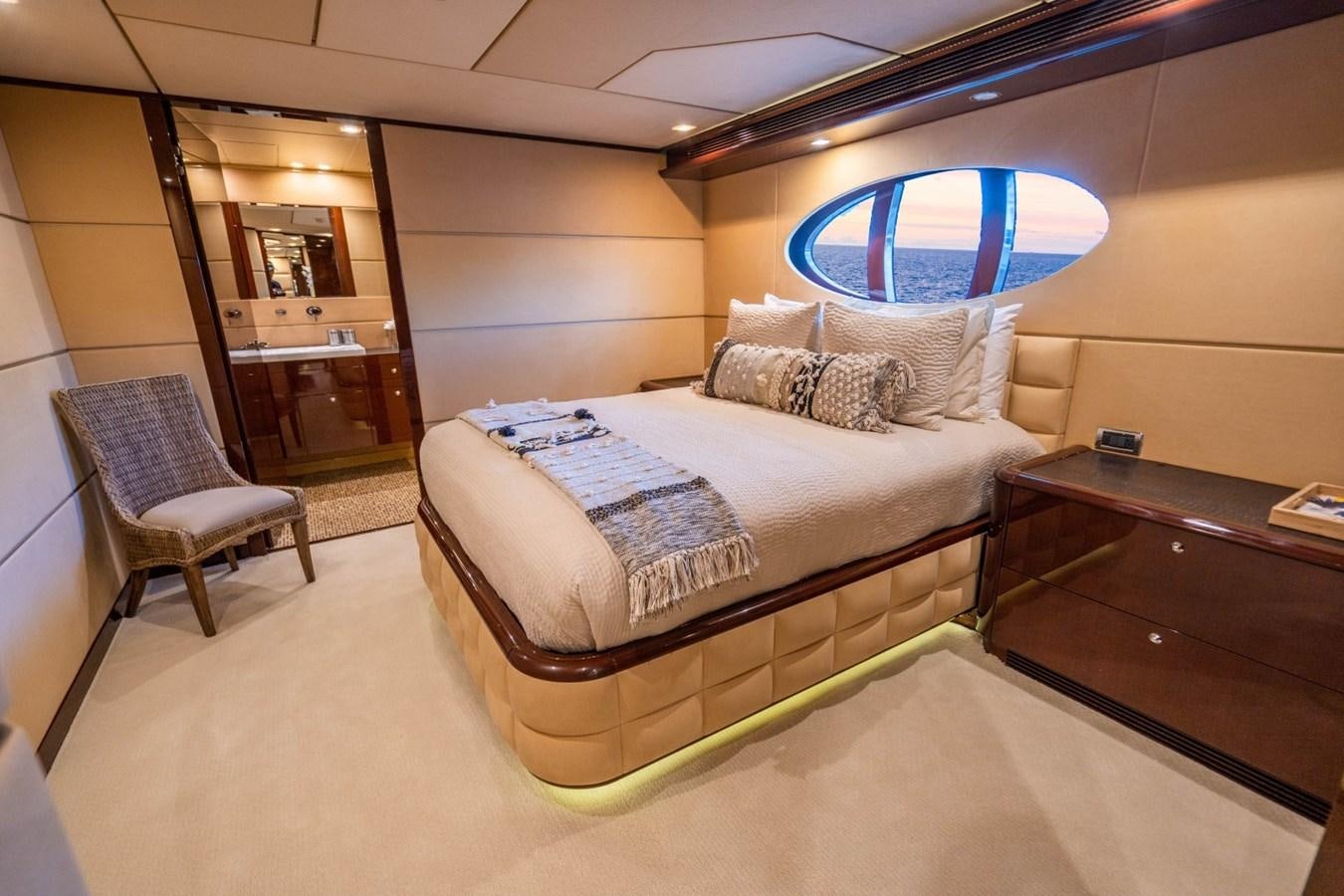 a bed in a room aboard DREAMER Yacht for Sale