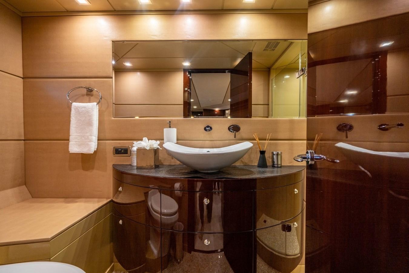 a bathroom with a sink and a mirror aboard DREAMER Yacht for Sale