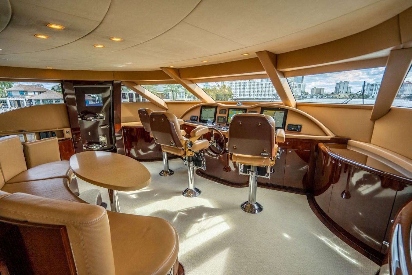 inside of a vehicle with chairs and tables and a large window aboard DREAMER Yacht for Sale