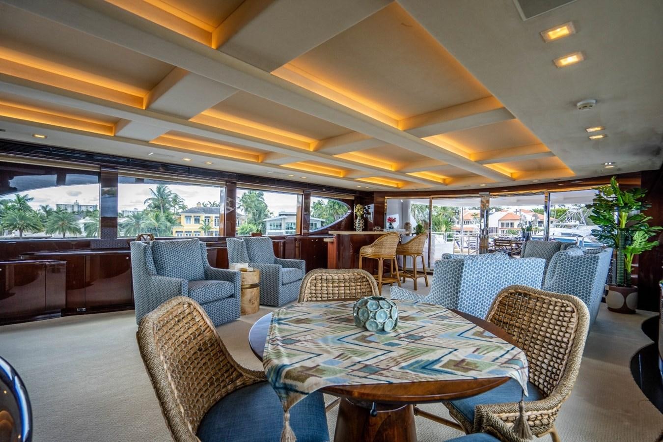 a dining room with a table and chairs aboard DREAMER Yacht for Sale