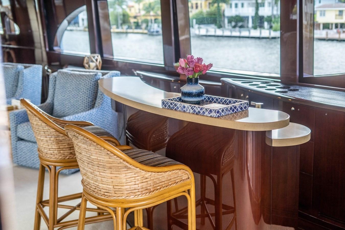 a table with chairs around it aboard DREAMER Yacht for Sale