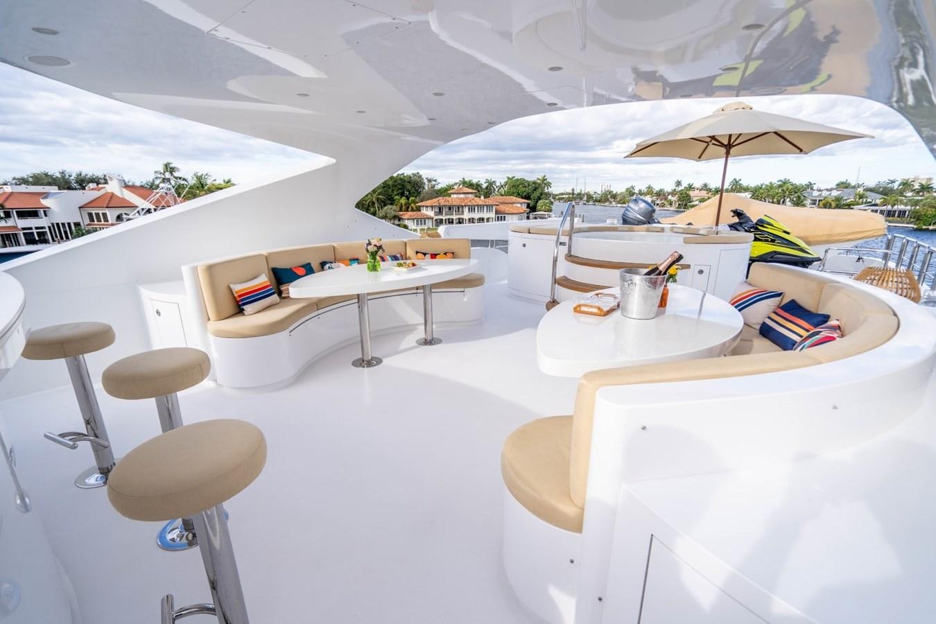 a table and chairs on a patio aboard DREAMER Yacht for Sale