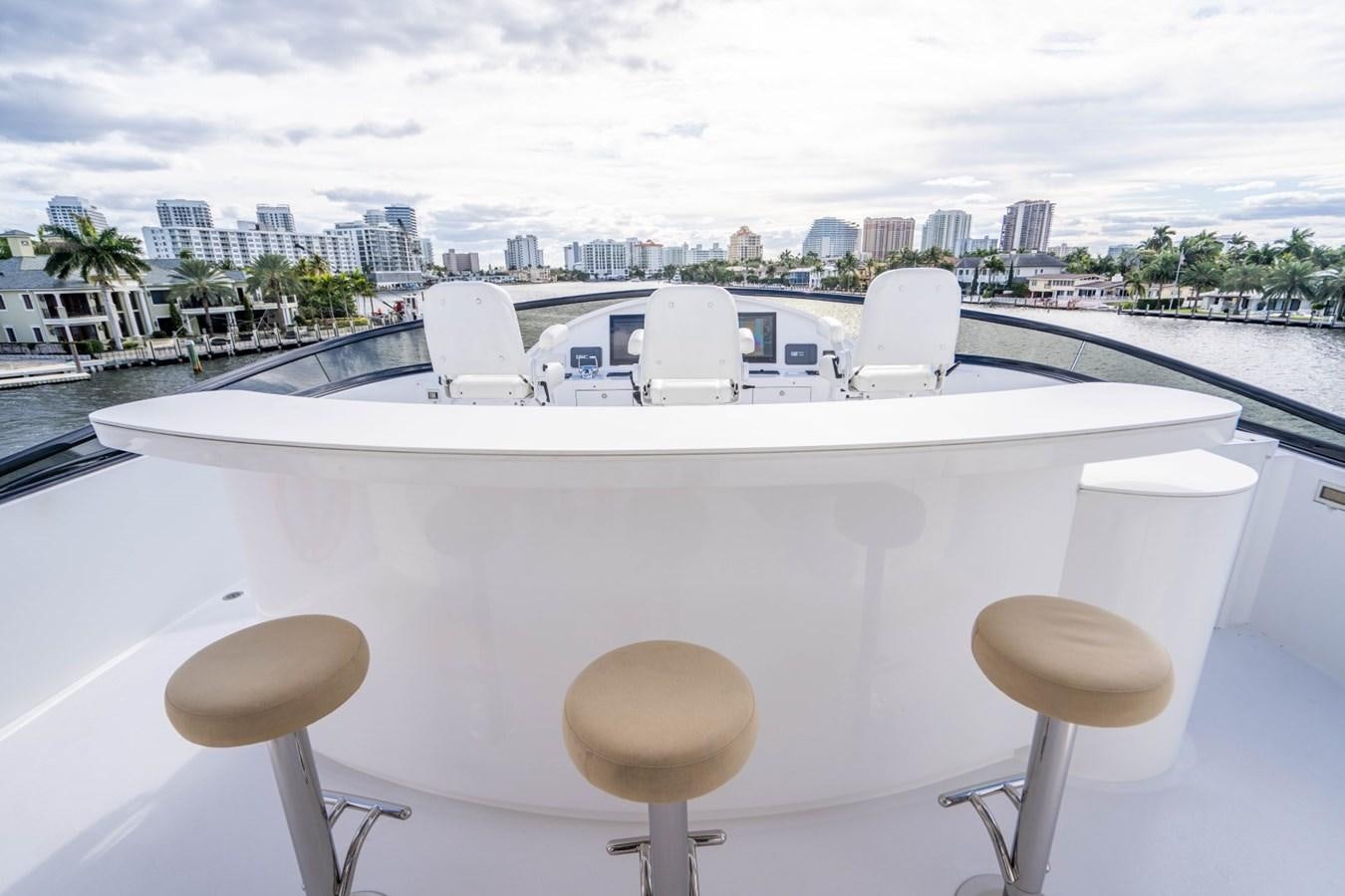 a white table with chairs on it aboard DREAMER Yacht for Sale