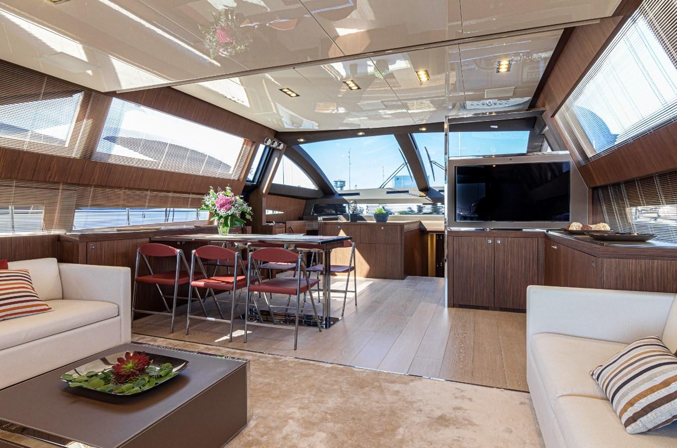 a room with a table and chairs aboard DONNA SANTA Yacht for Sale