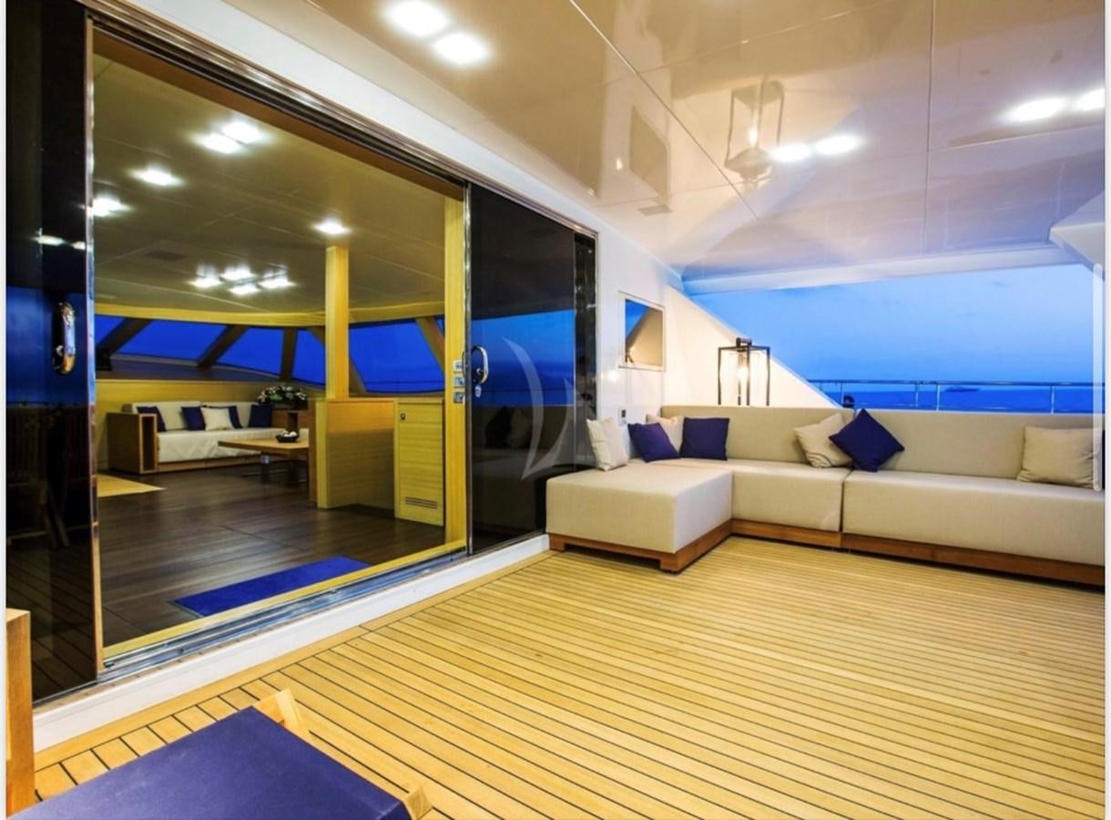 a room with a couch and a pool aboard MANTANI Yacht for Sale