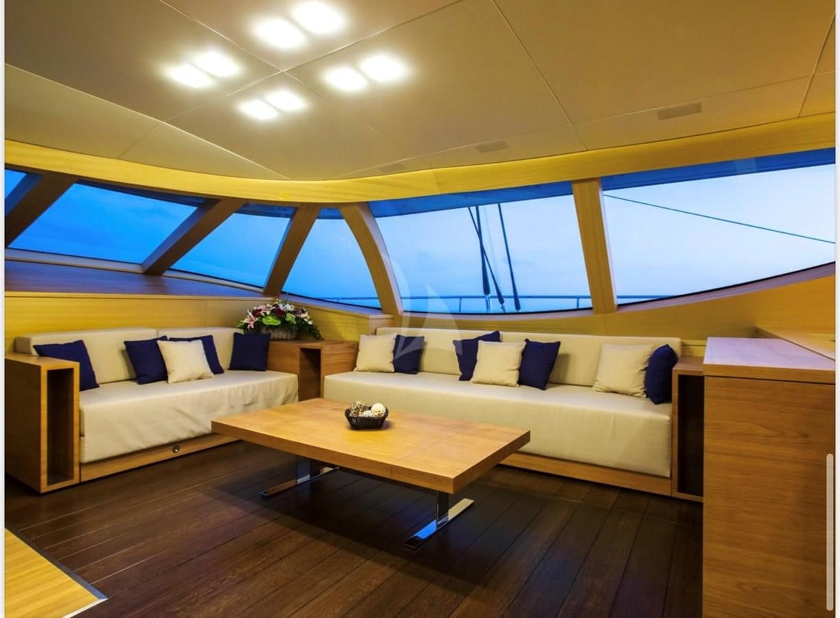 a living room with a couch and a table aboard MANTANI Yacht for Sale
