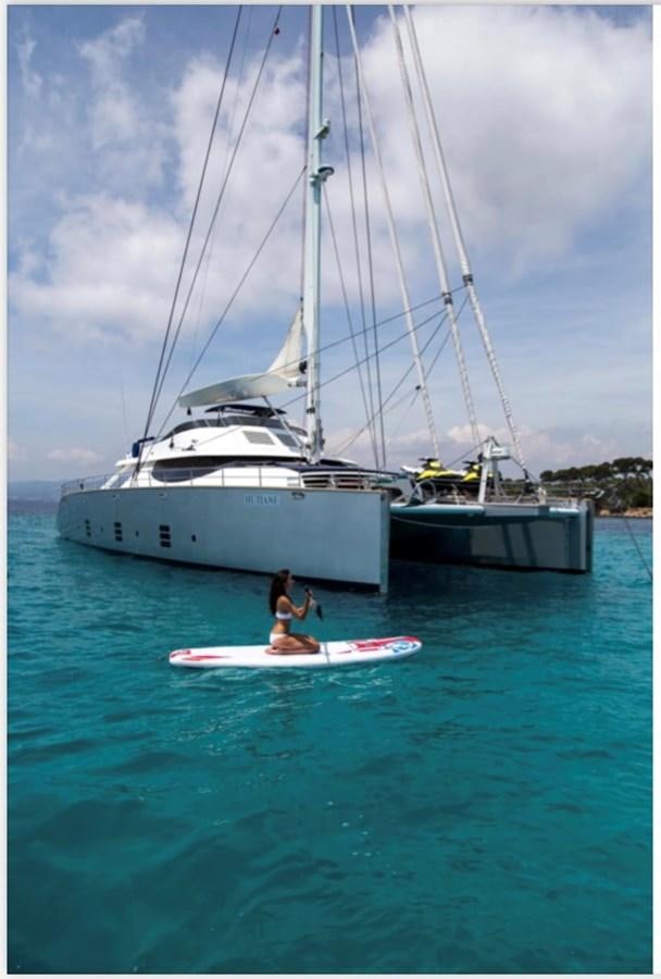 a man and a woman on a sailboat in the water aboard MANTANI Yacht for Charter