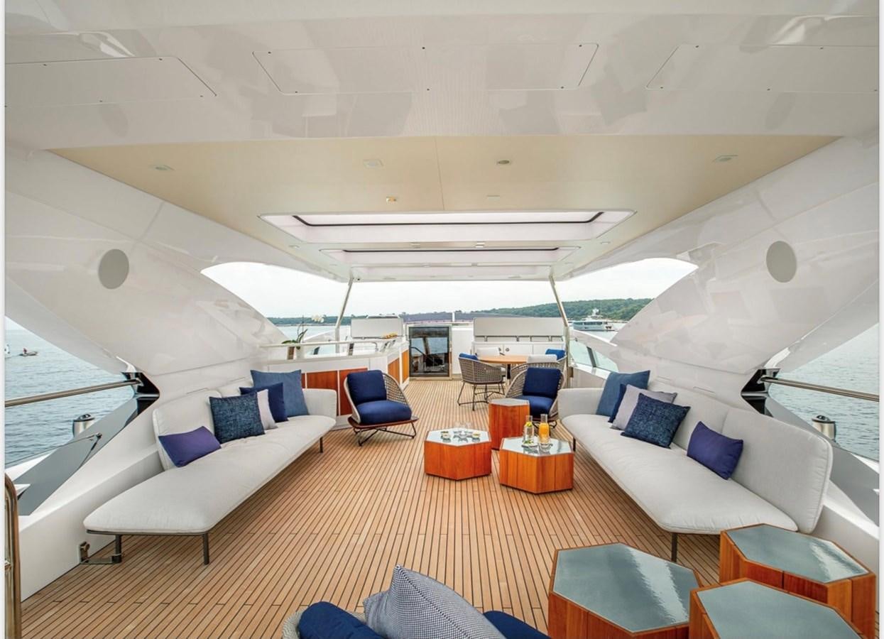 a room with a couch and a table and chairs aboard MILLESIME Yacht for Charter