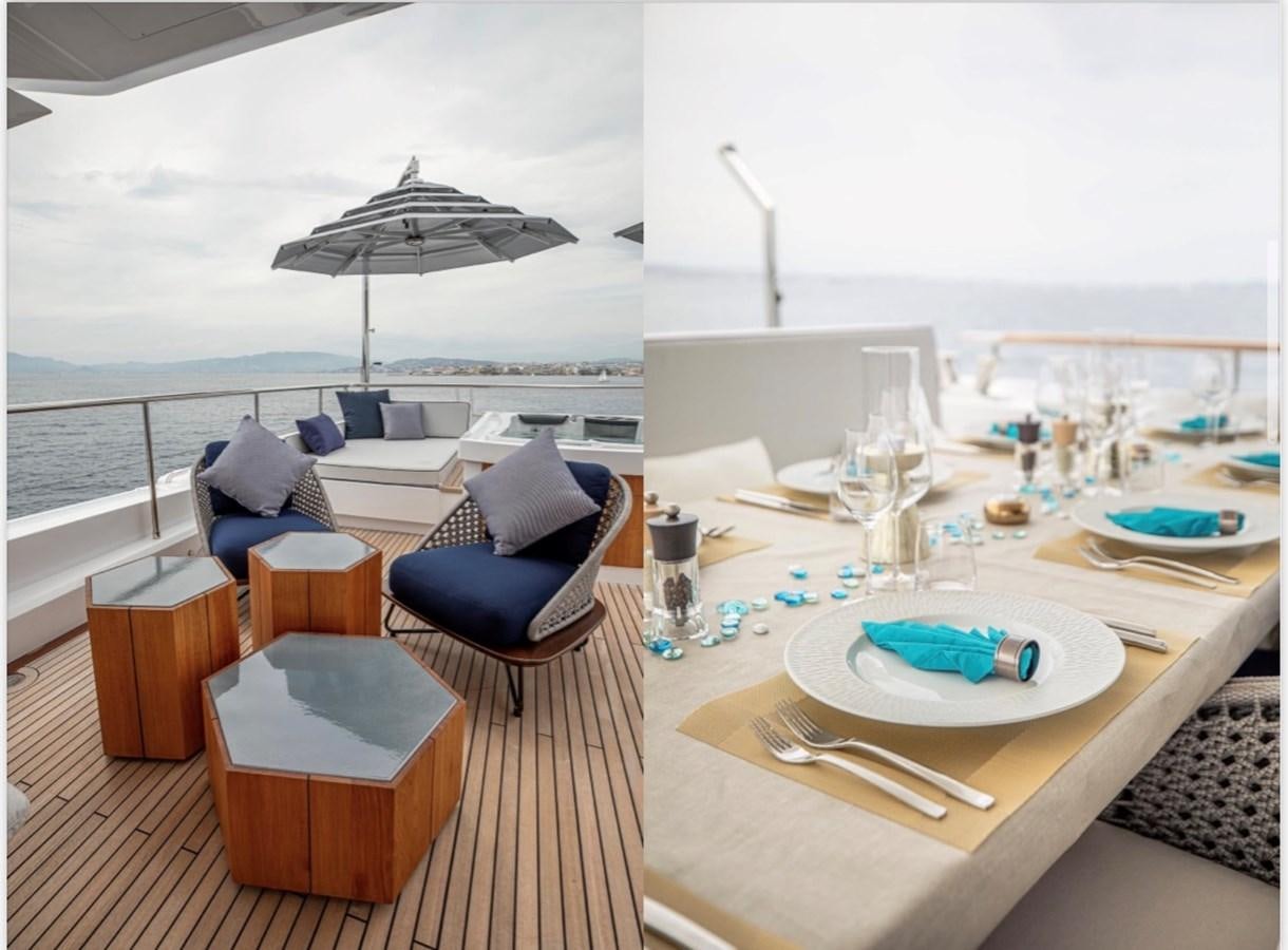 a table with chairs and a large umbrella on it aboard MILLESIME Yacht for Charter