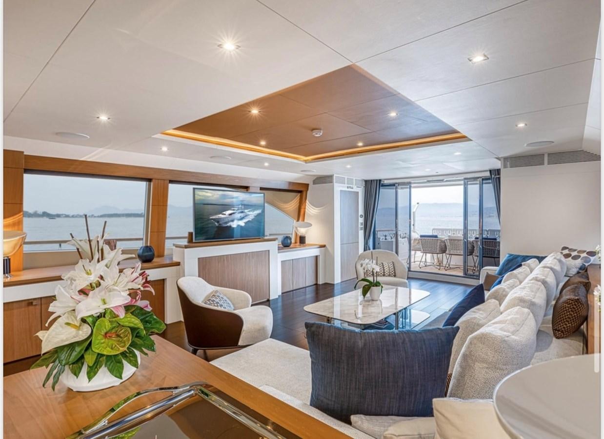 a living room with a large open window aboard MILLESIME Yacht for Charter