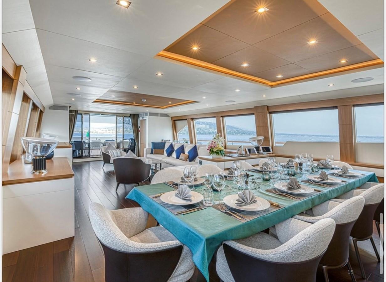 a dining room with a table set aboard MILLESIME Yacht for Charter