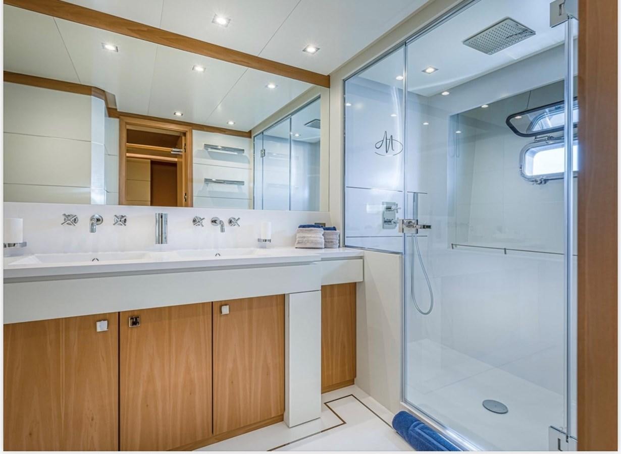 a bathroom with a shower unit aboard MILLESIME Yacht for Charter