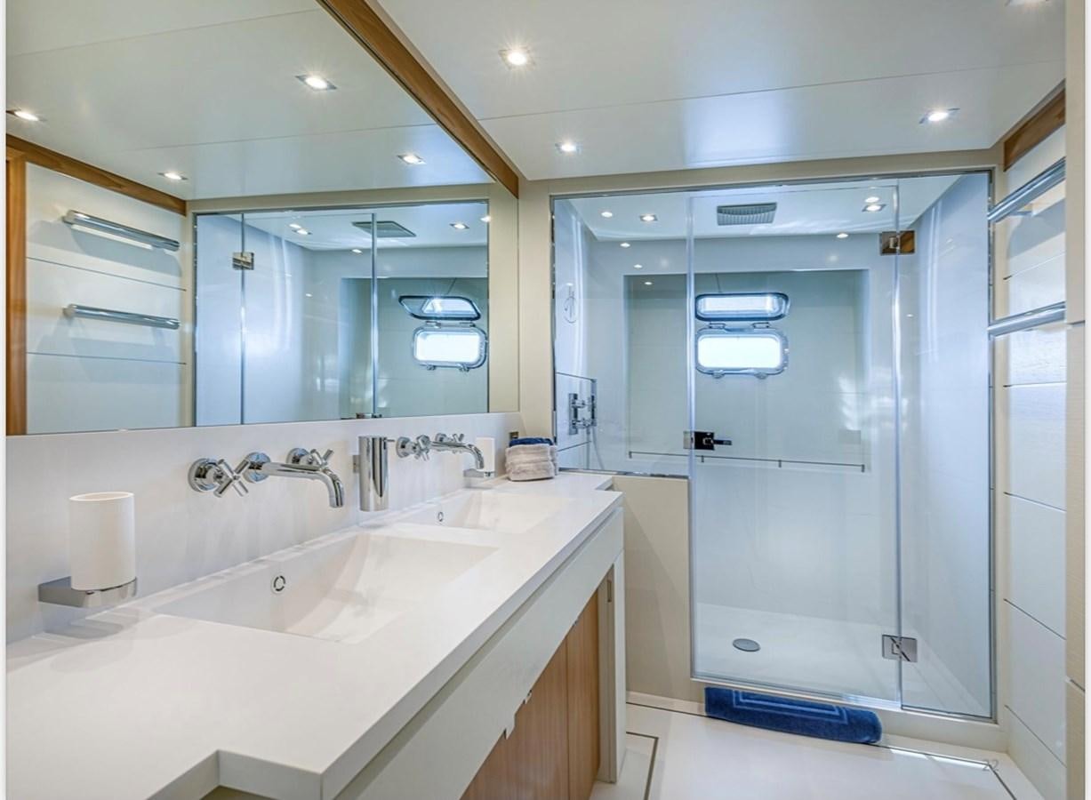 a bathroom with a large mirror aboard MILLESIME Yacht for Charter