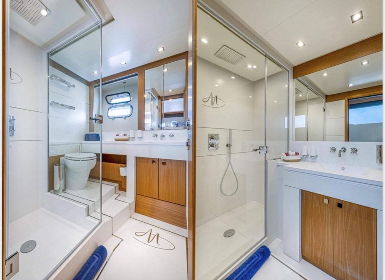 a bathroom with a shower and toilet aboard MILLESIME Yacht for Charter