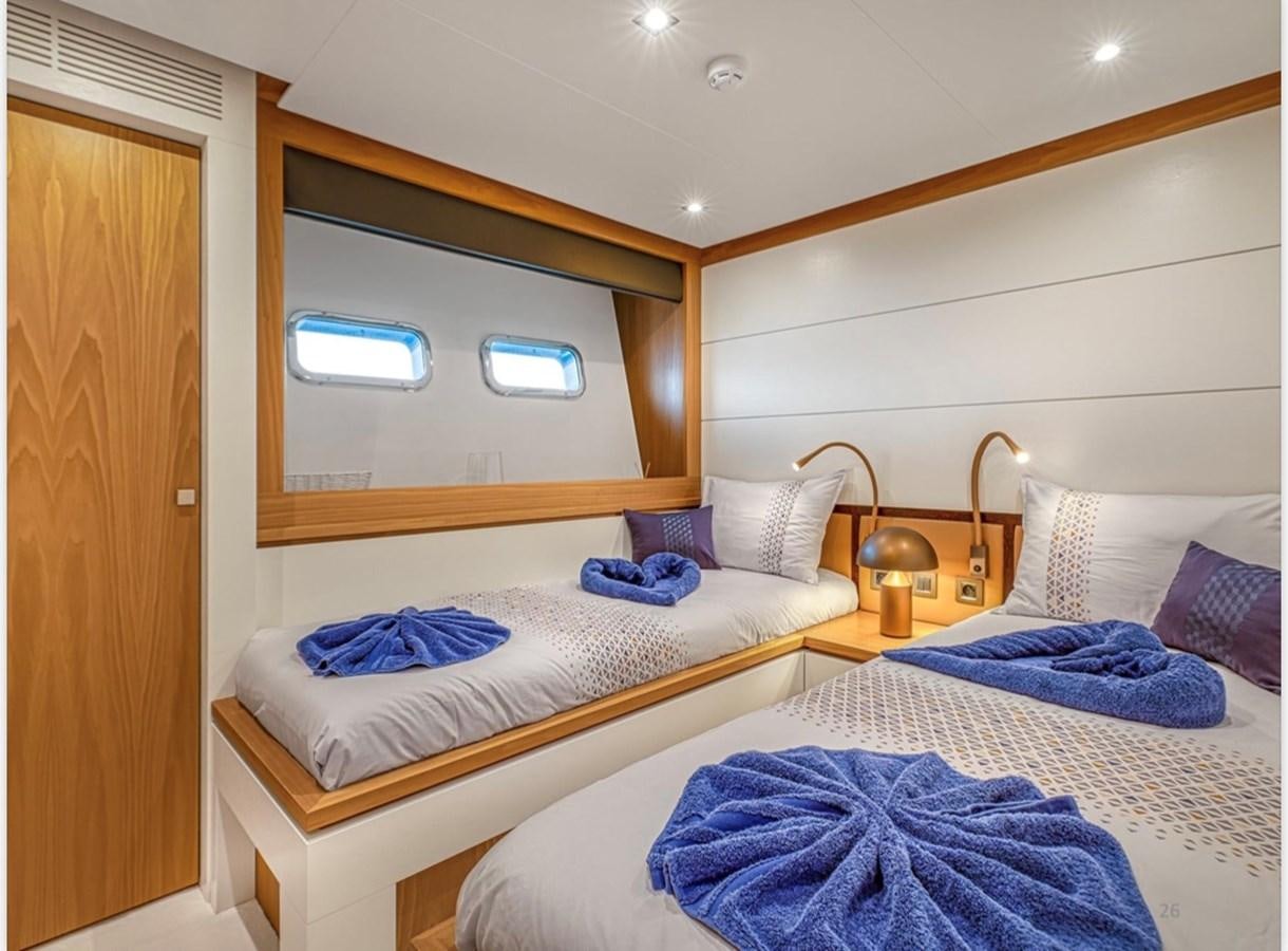a couple of beds in a room aboard MILLESIME Yacht for Charter