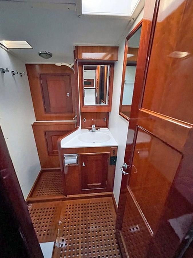 a bathroom with a sink and a mirror aboard SIROCCO Yacht for Sale