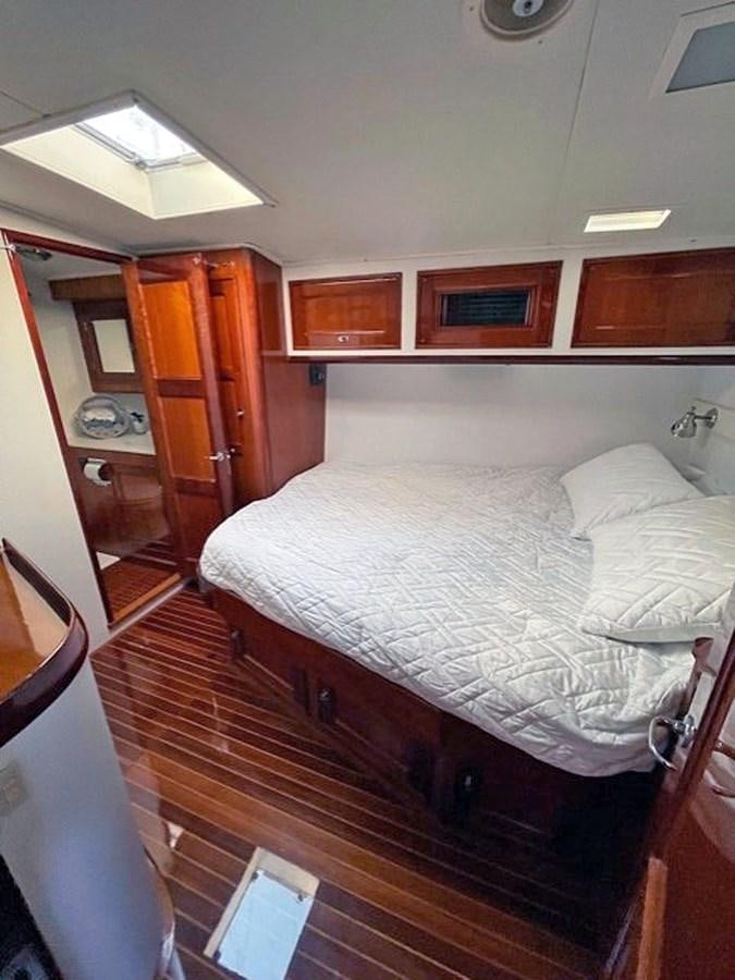 a bed in a room aboard SIROCCO Yacht for Sale