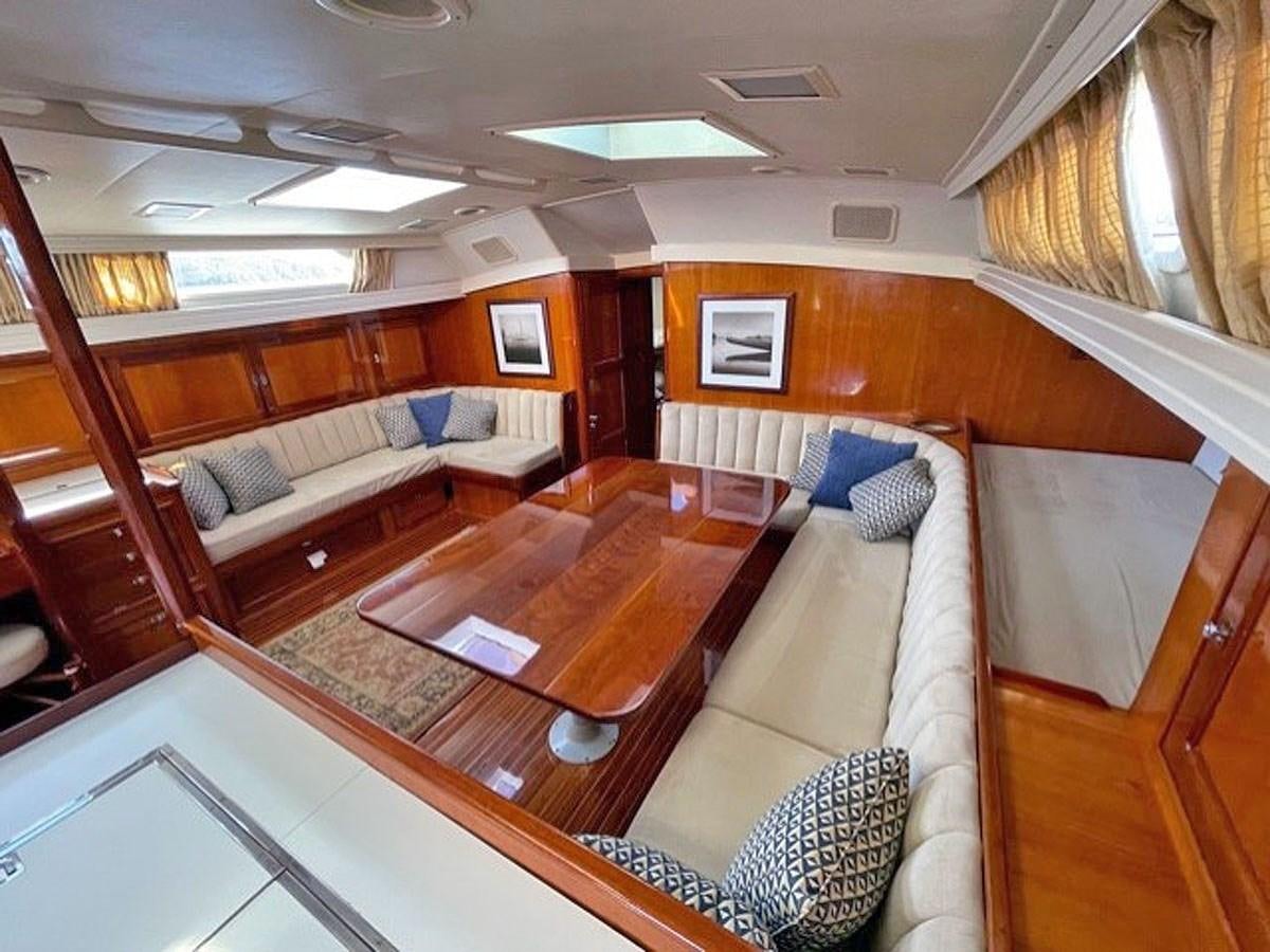 a room with a couch and a table aboard SIROCCO Yacht for Sale