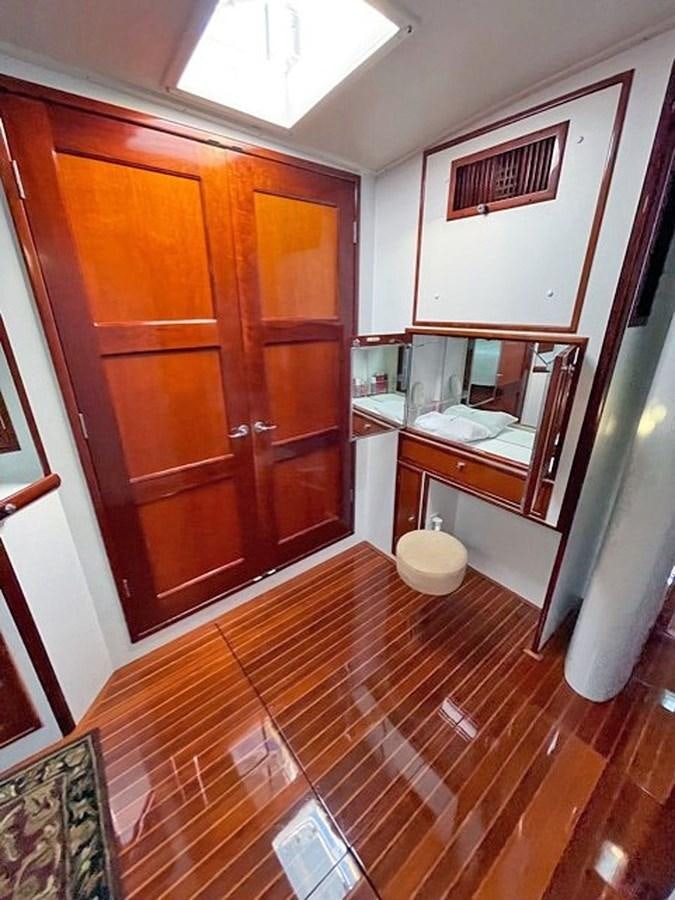 a bathroom with wooden cabinets aboard SIROCCO Yacht for Sale