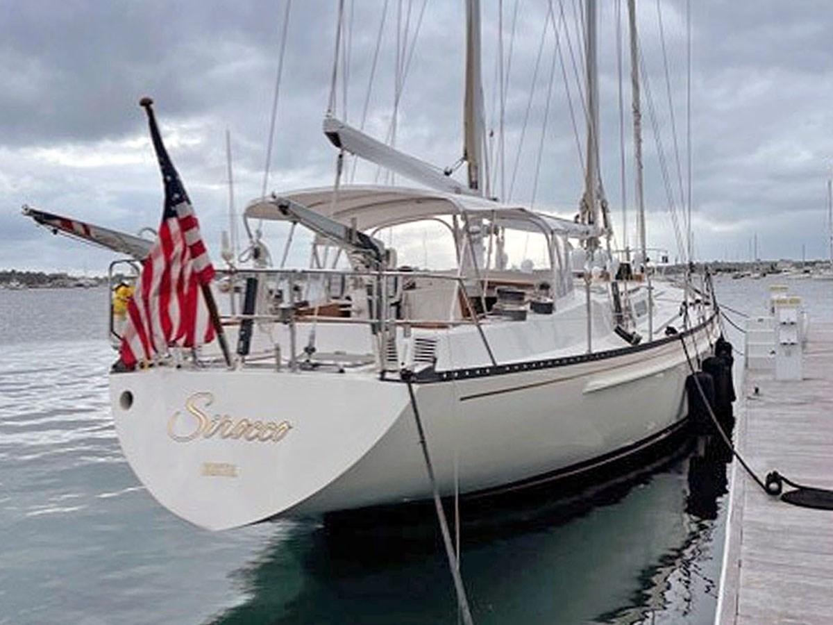 a boat with a flag on the front aboard SIROCCO Yacht for Sale