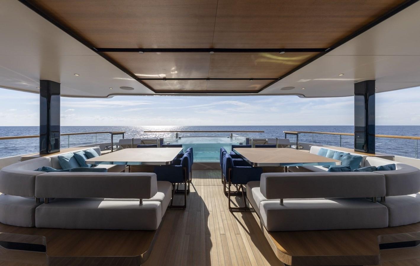 a room with a view of the ocean and the deck aboard C Yacht for Sale