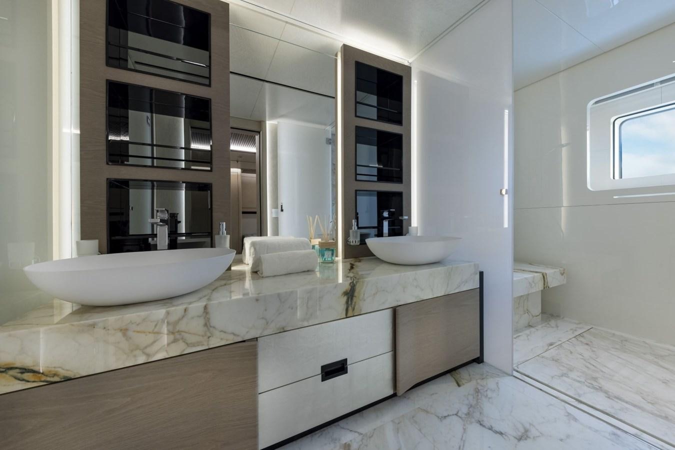 a bathroom with a large countertop aboard C Yacht for Sale