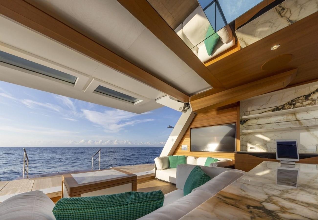 a room with a view of the ocean and the deck aboard C Yacht for Sale