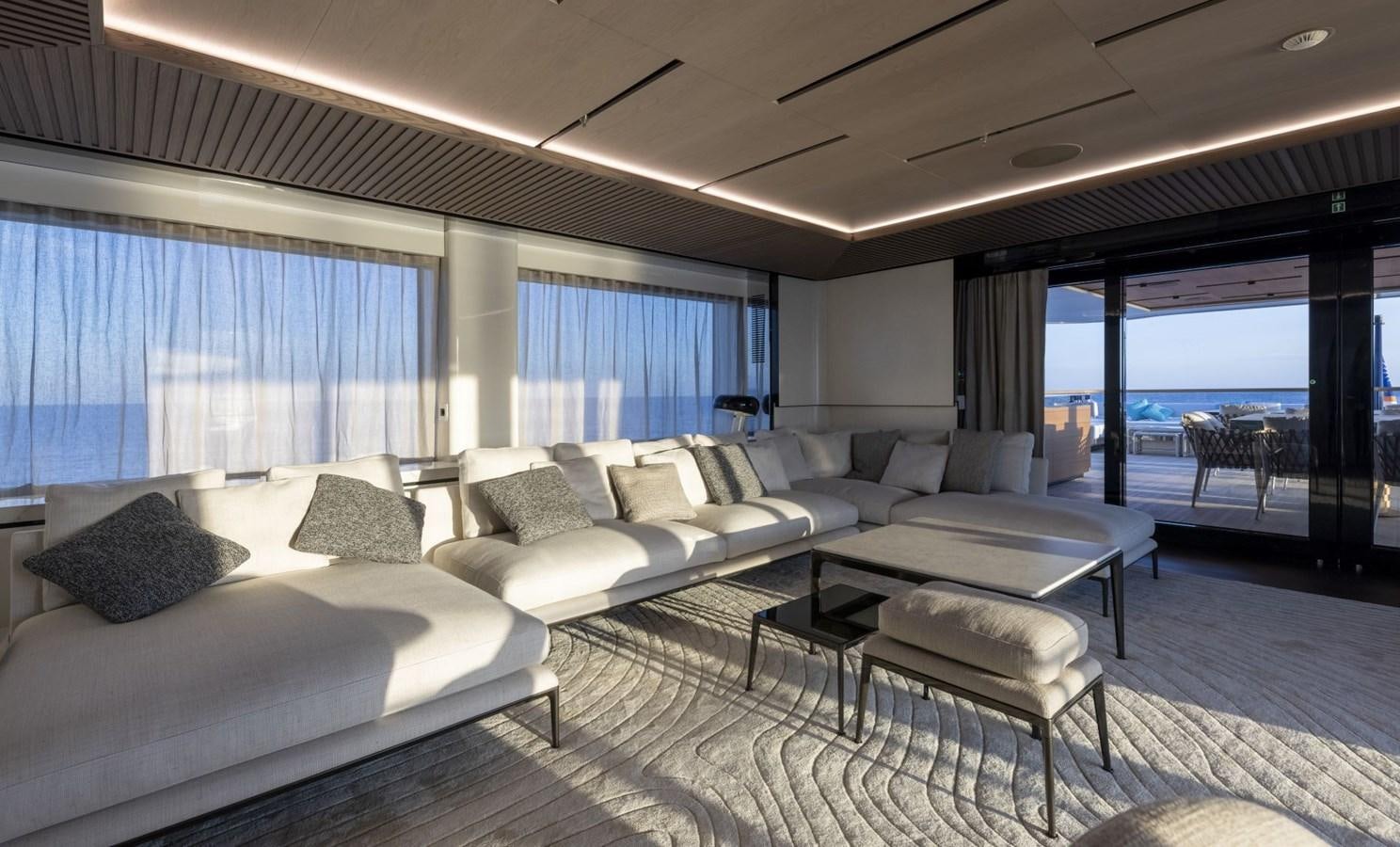 a room with a couch and a table aboard C Yacht for Sale