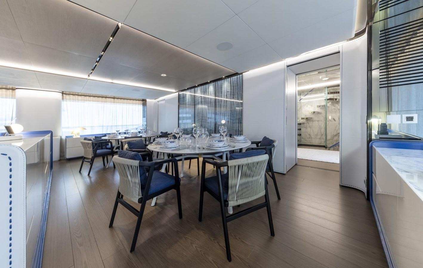 a large dining room with a table and chairs aboard C Yacht for Sale