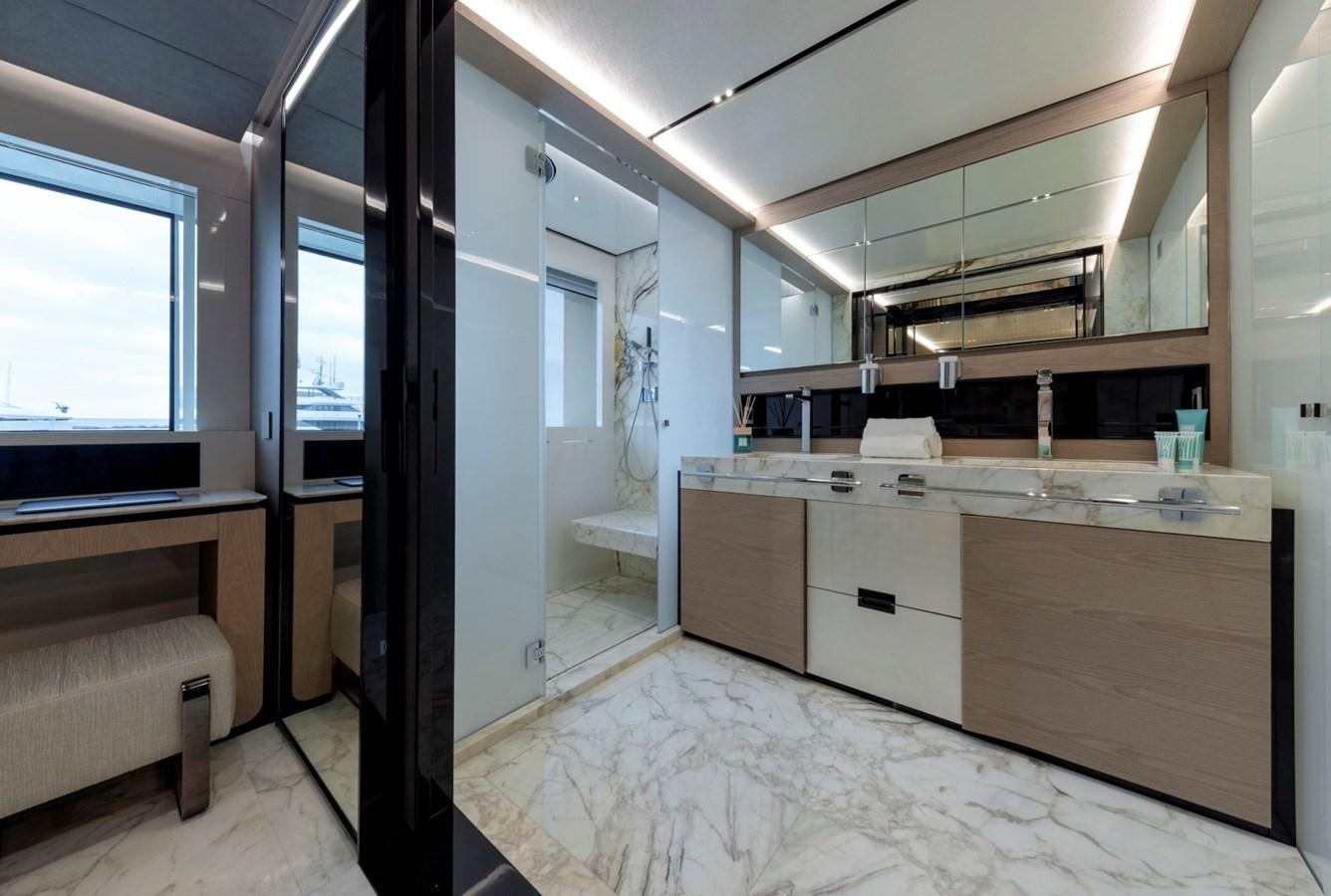 a room with a bed and a desk aboard C Yacht for Sale