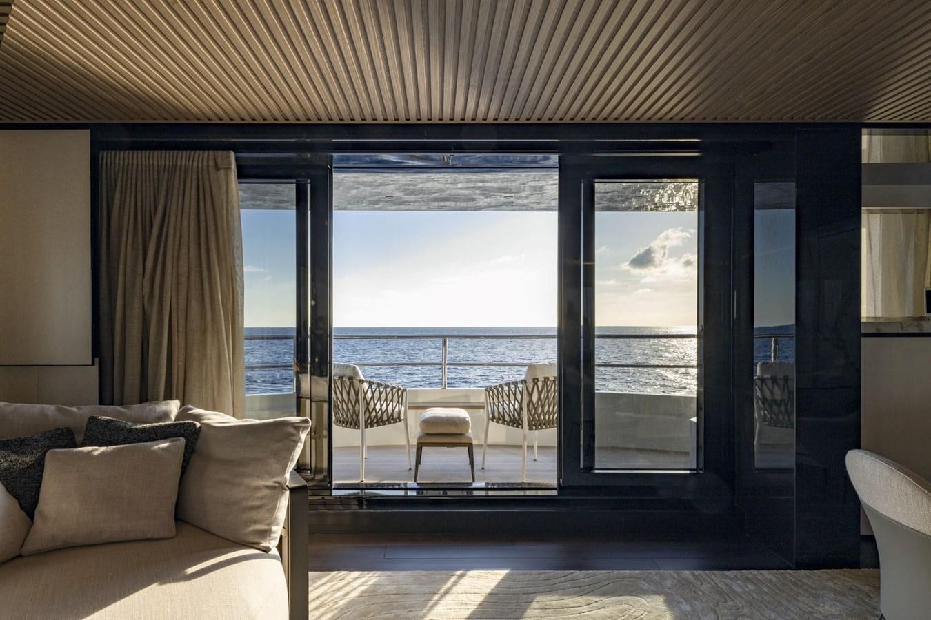 a room with a large window and a view of the water aboard C Yacht for Sale