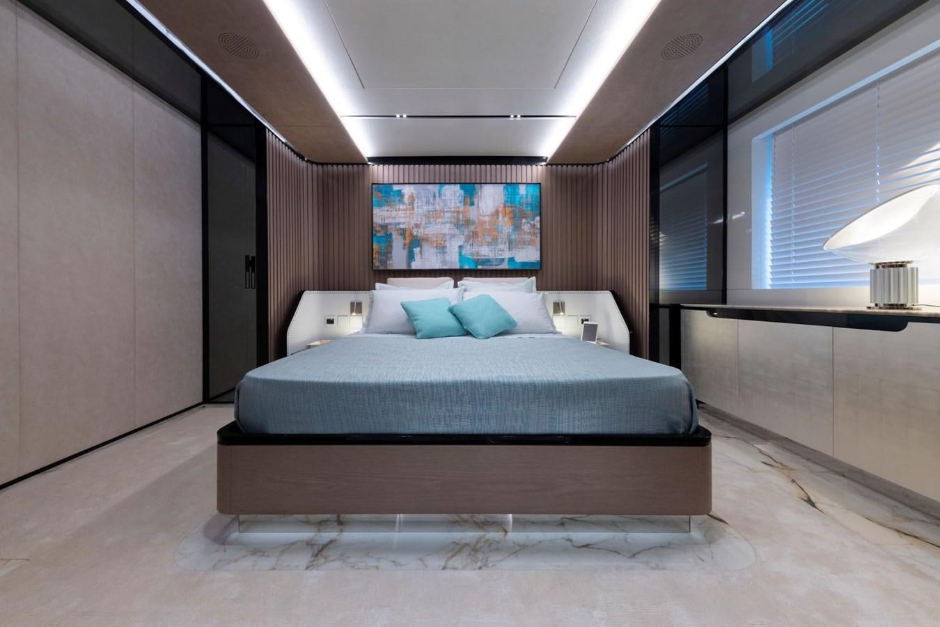 a bed in a room aboard C Yacht for Sale