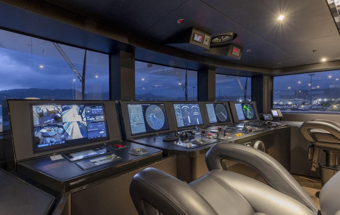 a control room with many monitors aboard C Yacht for Sale