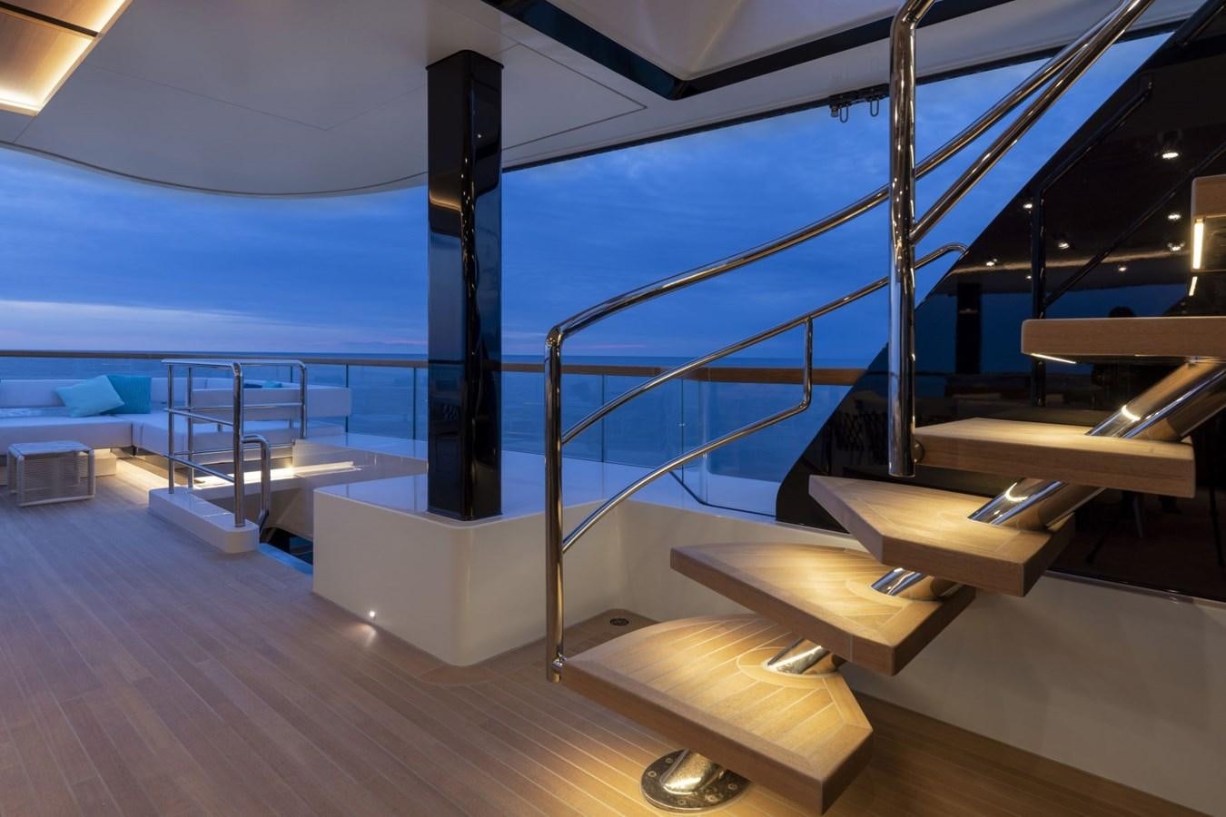 a room with a large deck and a view of the ocean aboard C Yacht for Sale
