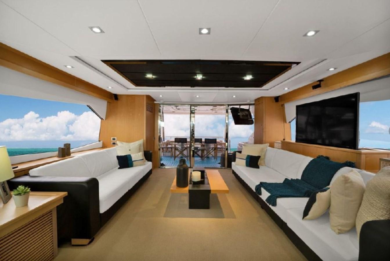 a room with a large window and a large television aboard SEADUCTION Yacht for Sale