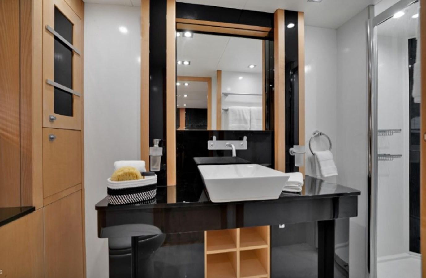 a bathroom with a sink and mirror aboard SEADUCTION Yacht for Sale