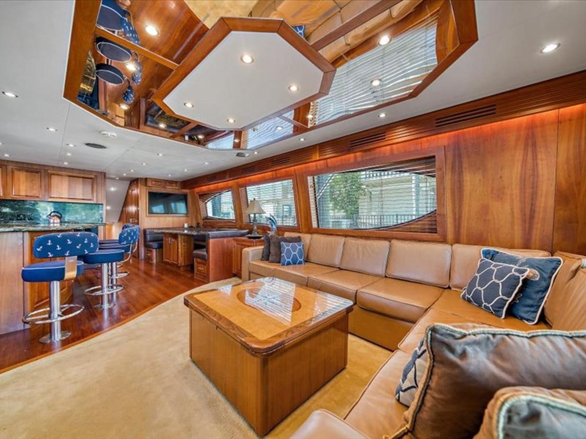 a living room with wood walls and a wood floor aboard EVA VII Yacht for Sale