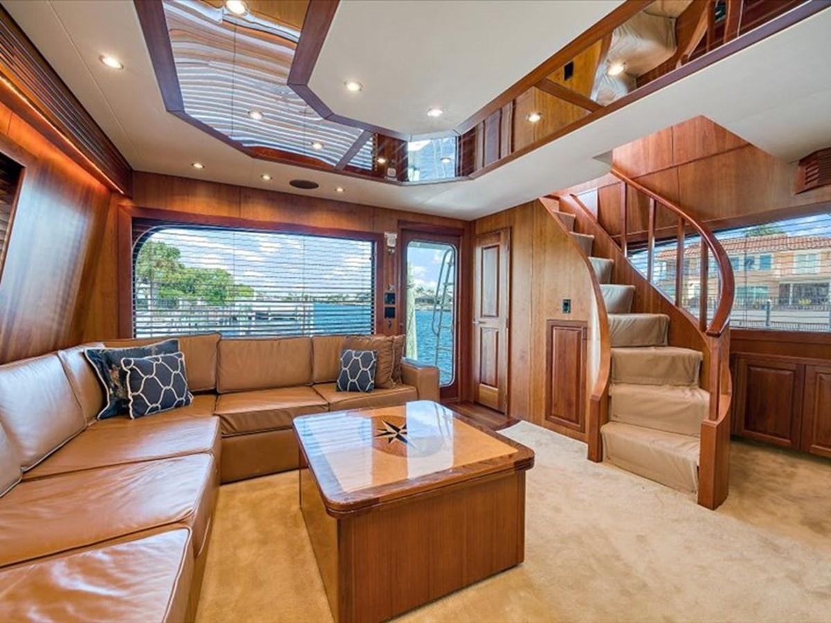 a living room with a staircase aboard EVA VII Yacht for Sale