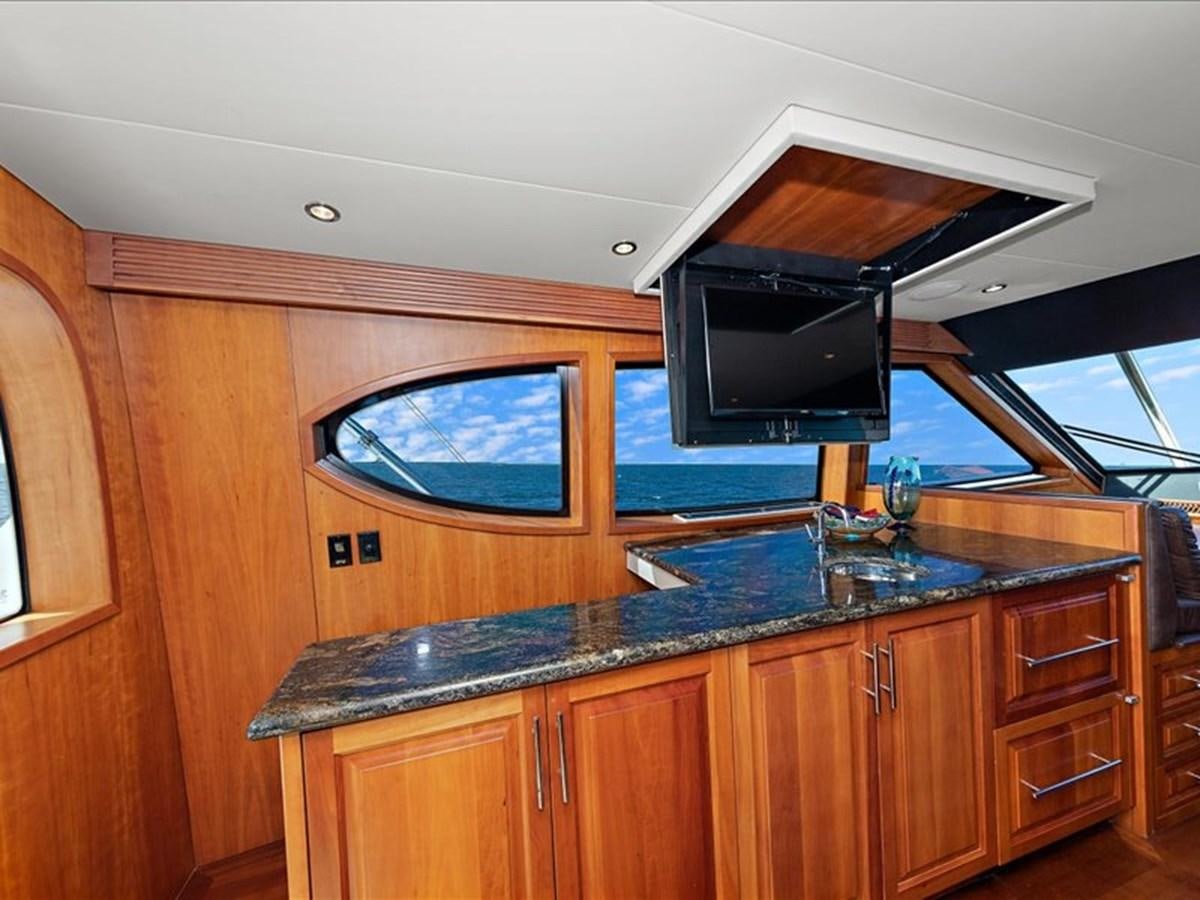 a kitchen with a large tv aboard EVA VII Yacht for Sale