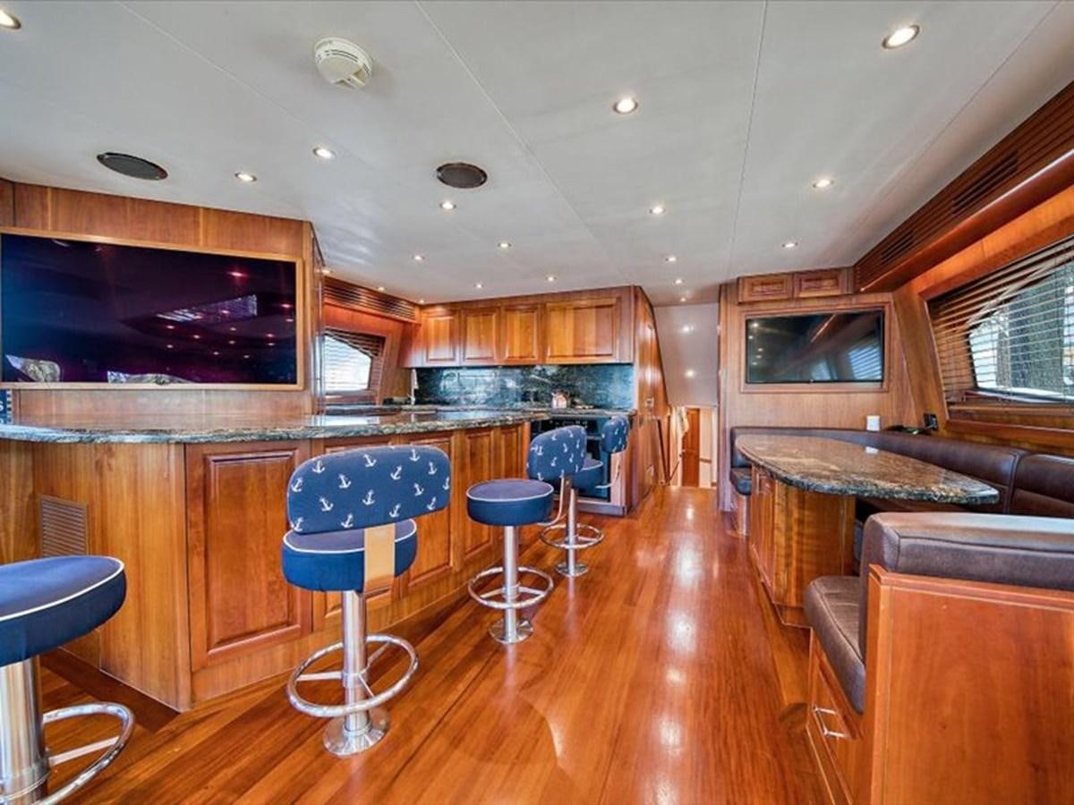 a large room with a bar and a bar aboard EVA VII Yacht for Sale