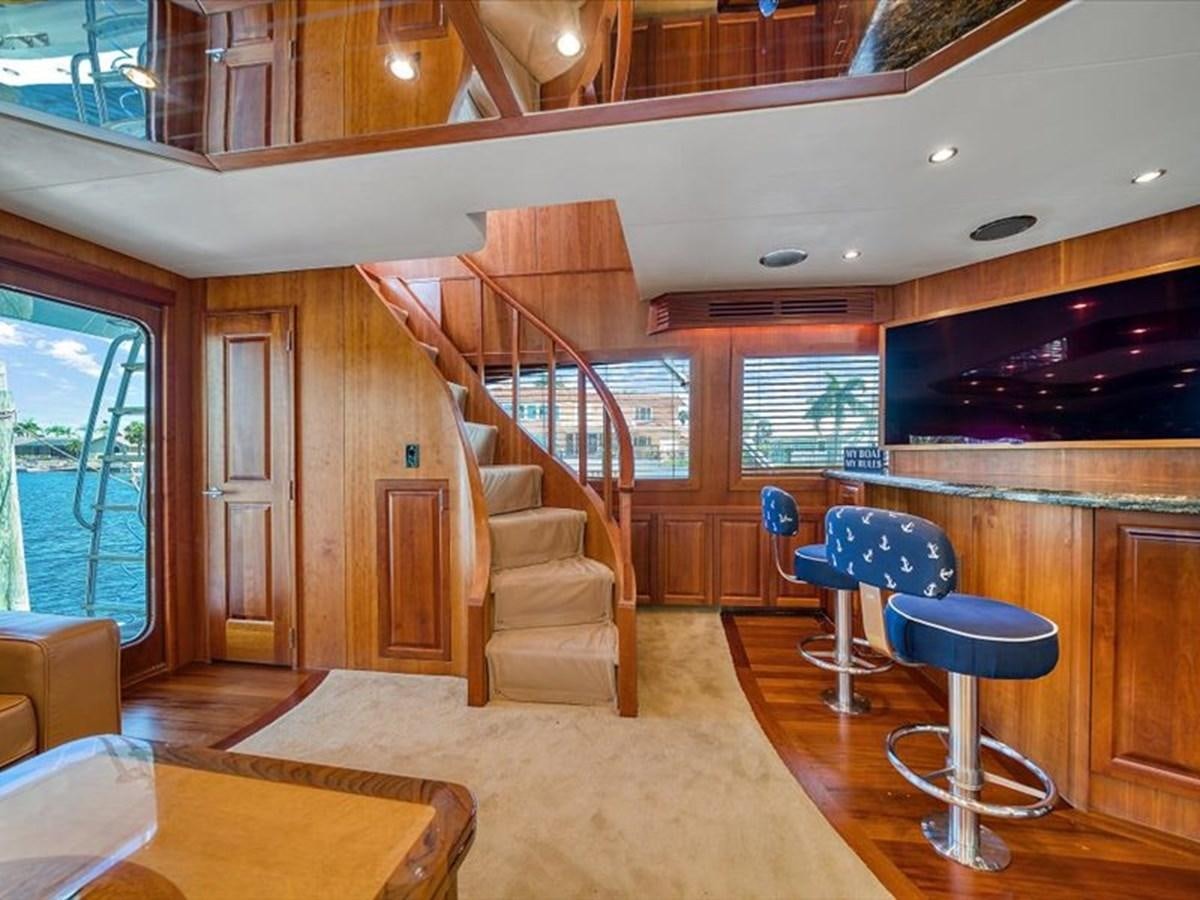 a room with a table and chairs aboard EVA VII Yacht for Sale