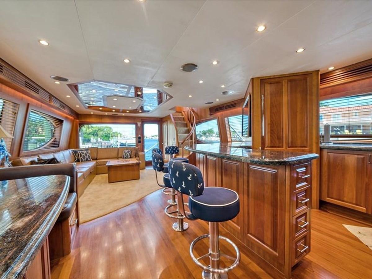 a kitchen with a bar and a bar aboard EVA VII Yacht for Sale