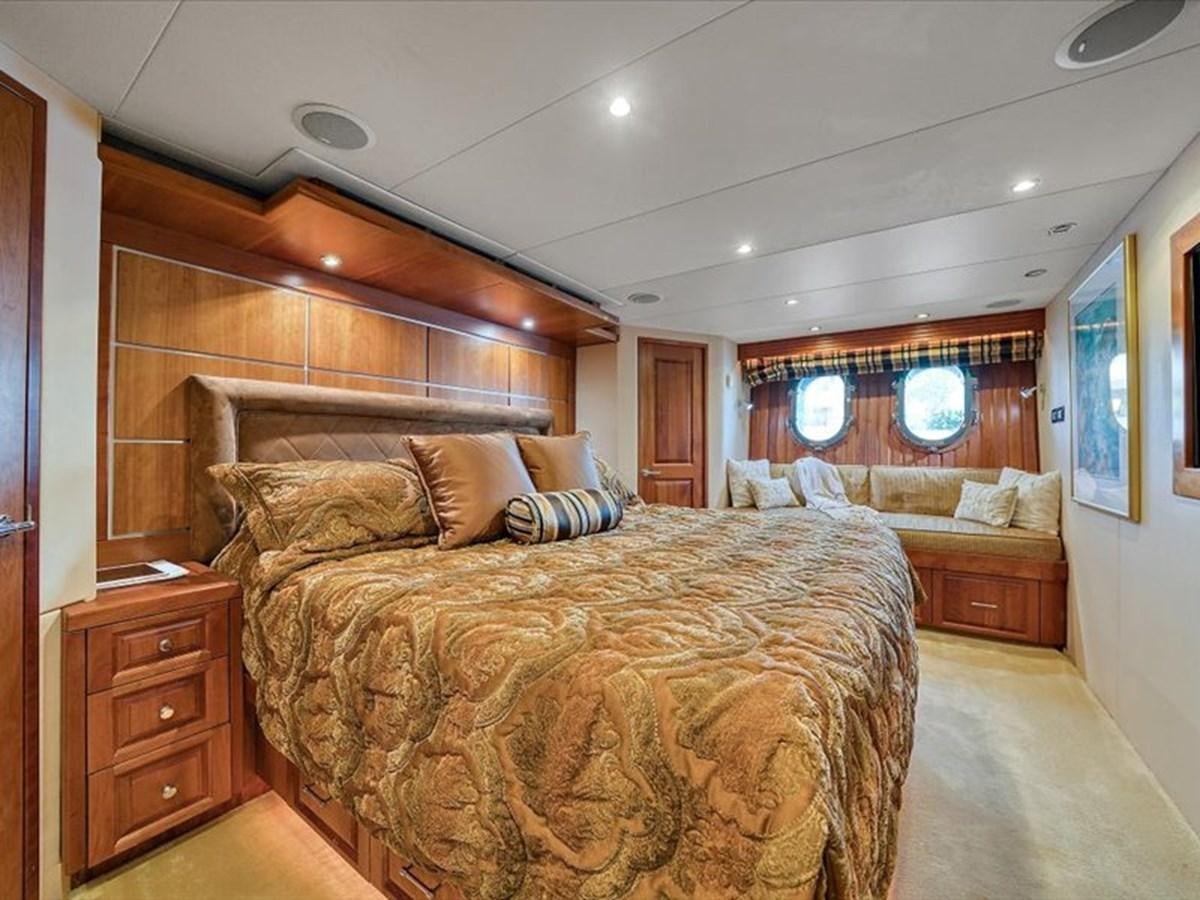 a large bedroom with a large bed aboard EVA VII Yacht for Sale