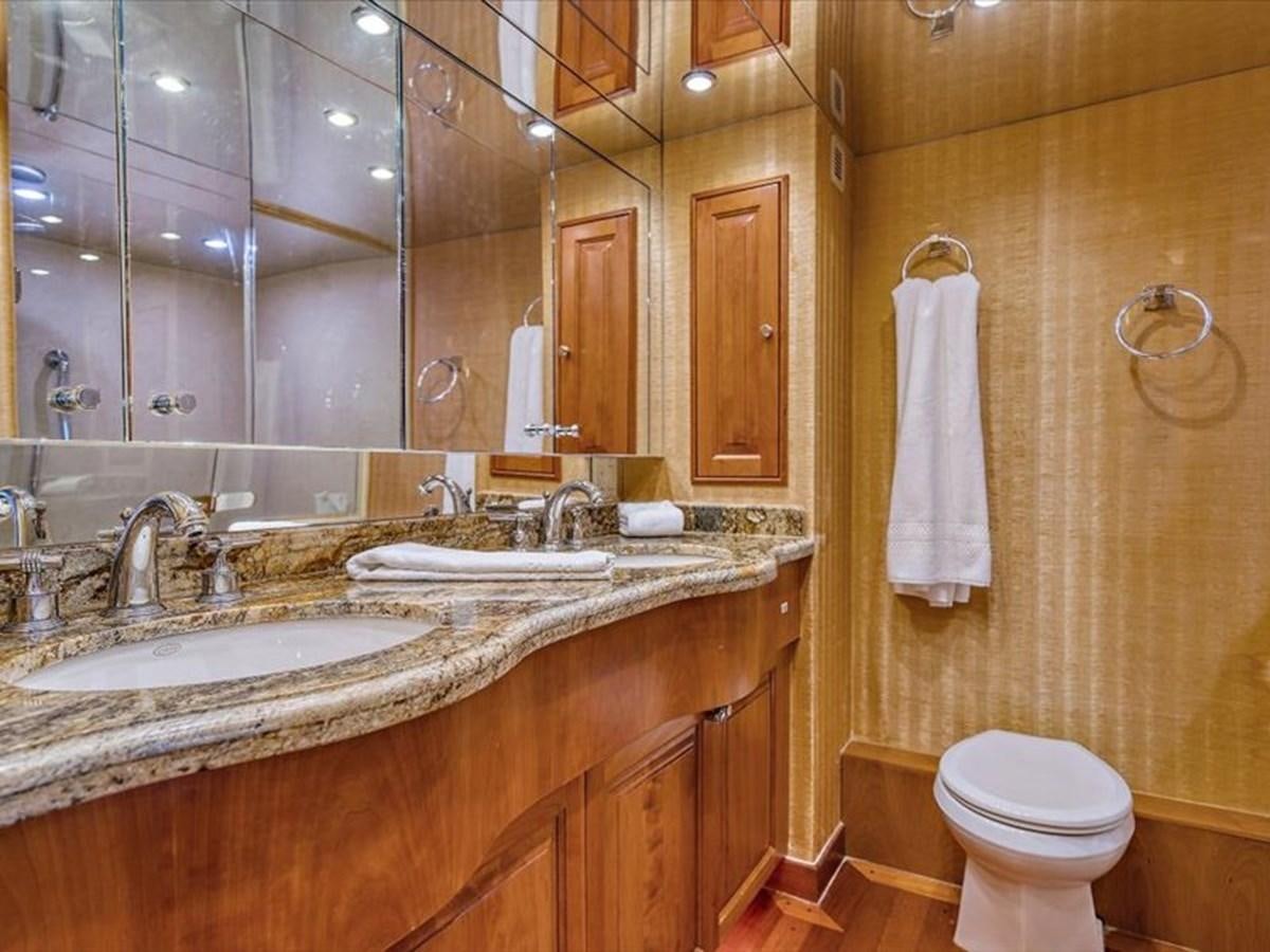 a bathroom with a sink and toilet aboard EVA VII Yacht for Sale