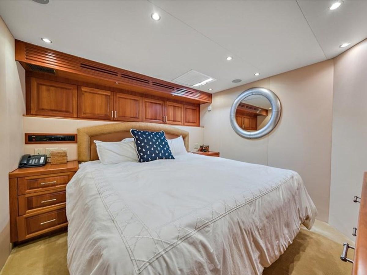 a bed with a mirror above it aboard EVA VII Yacht for Sale