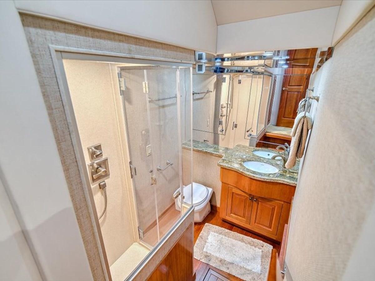 a bathroom with a sink and a shower aboard EVA VII Yacht for Sale